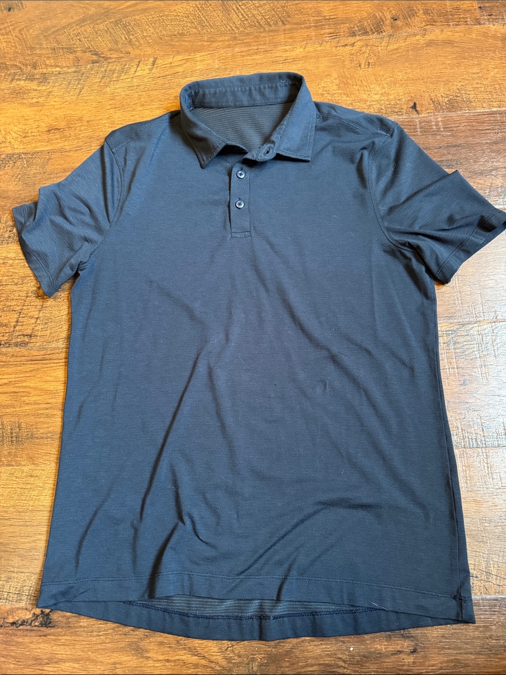 Men’s S Lululemon ABC polo shirt in a nice rich navy blue color.